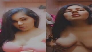 Indian girlfriend flaunts large breasts in nude video